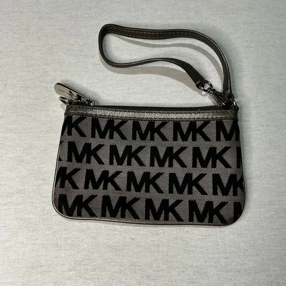 Michael Kors Jet Set wristlet in the Signature logo print